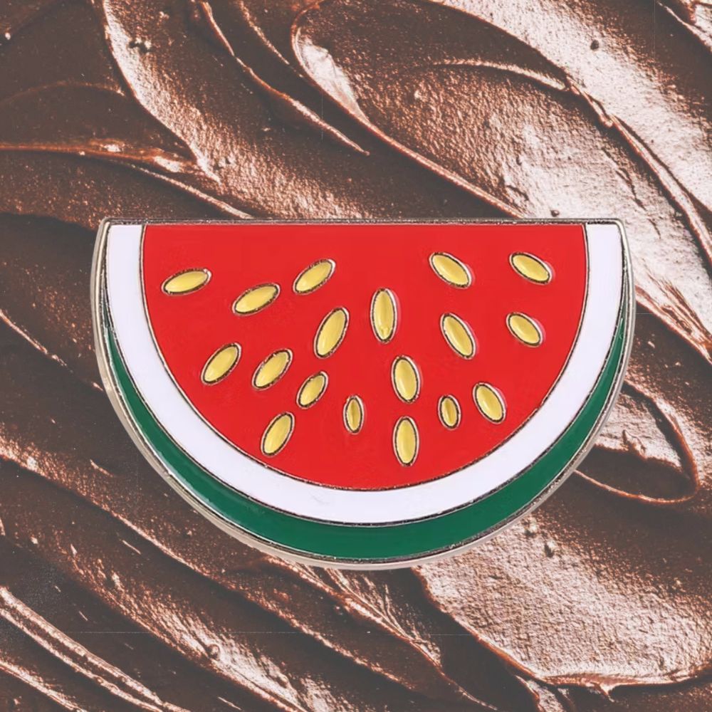 Watermelon slice pin on a chocolate background